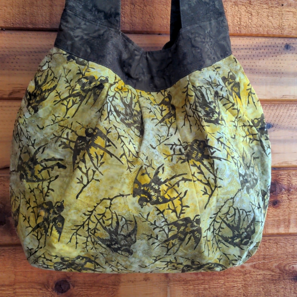 Cotton bag in brown and yellow with swallows, new condition